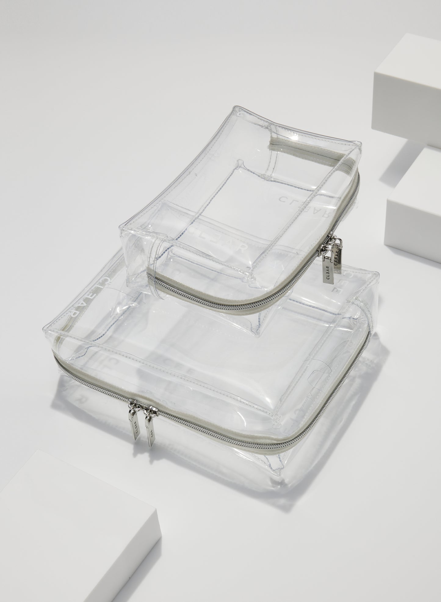 CLEAR LARGE + SMALL COSMETIC CASE SET