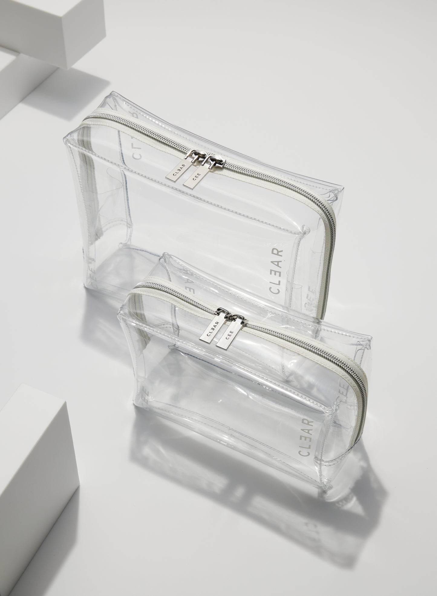 CLEAR LARGE + SMALL COSMETIC CASE SET